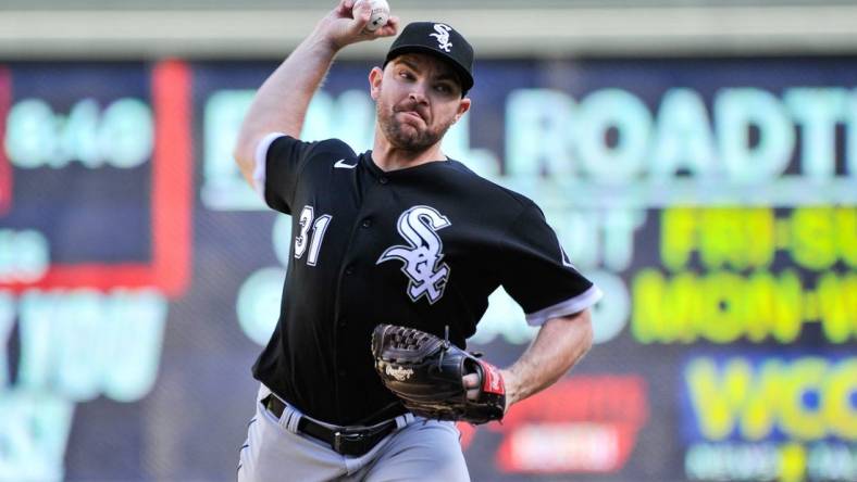 Sep 29, 2022; Minneapolis, Minnesota, USA; Chicago White Sox relief pitcher Liam Hendriks (31) throws a pitch against the Minnesota Twins during the ninth inning at Target Field. Mandatory Credit: Jeffrey Becker-USA TODAY Sports