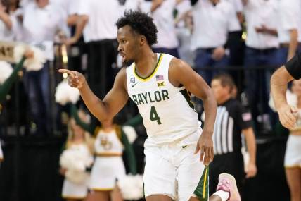 Jan 23, 2023; Waco, Texas, USA; Baylor Bears guard LJ Cryer (4) reacts after scoring a three-point basket against the Kansas Jayhawks during the first half at Ferrell Center. Mandatory Credit: Chris Jones-USA TODAY Sports
