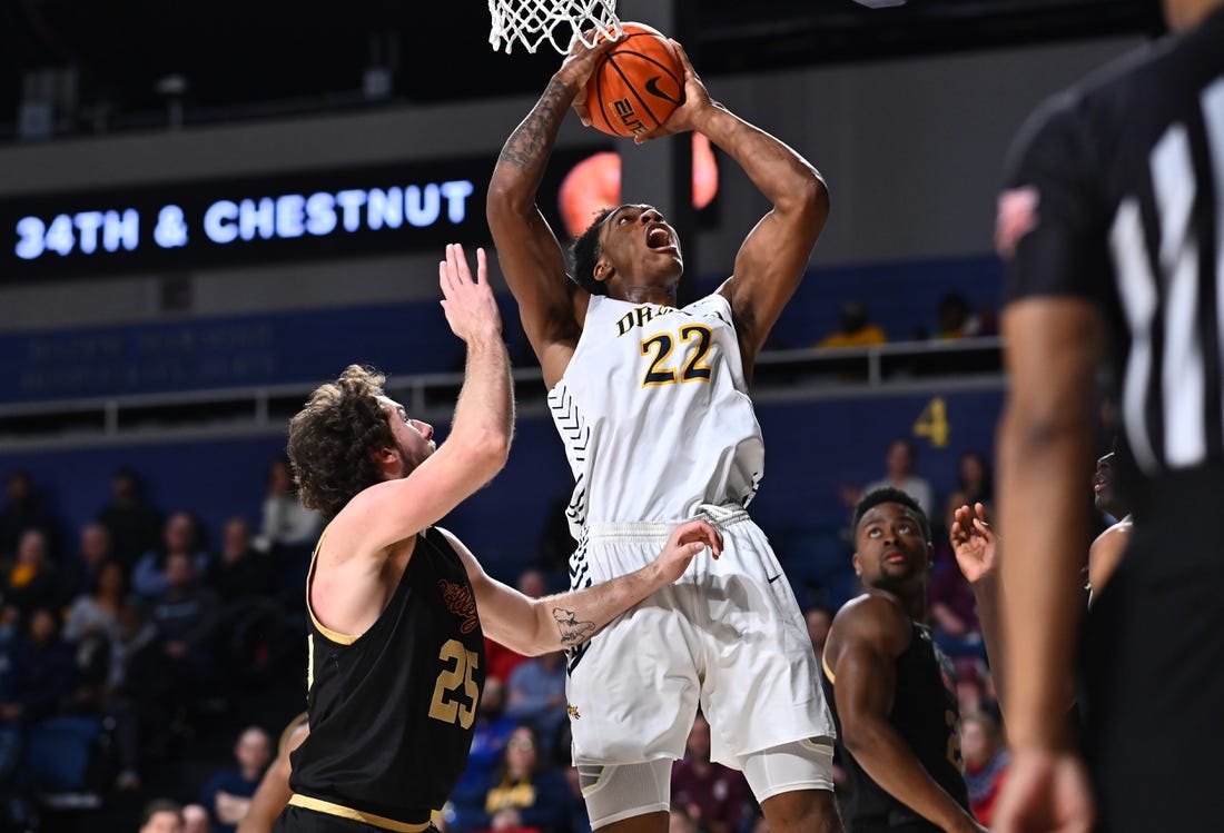 Feb 2, 2023; Philadelphia, Pennsylvania, USA; Drexel Dragons forward Amari Williams (22) shoots over Charleston Cougars forward Ben Burnham (25) in the second half at Daskalakis Athletic Center. Mandatory Credit: Kyle Ross-USA TODAY Sports