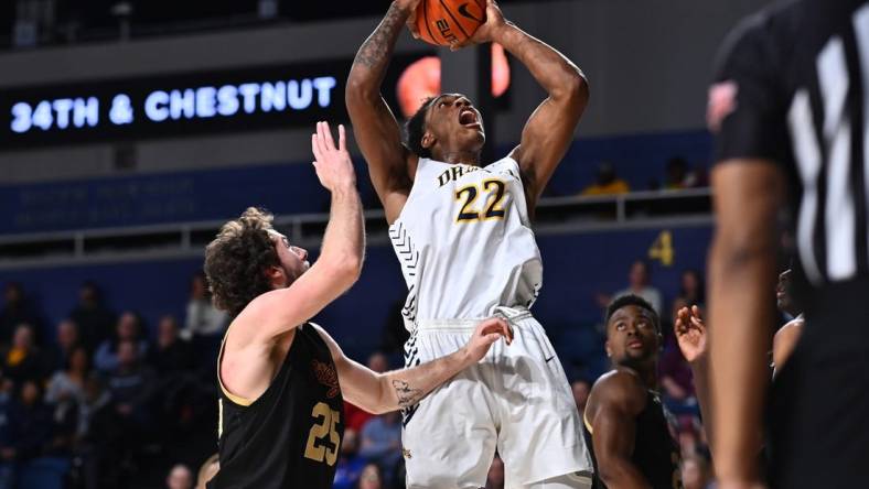 Feb 2, 2023; Philadelphia, Pennsylvania, USA; Drexel Dragons forward Amari Williams (22) shoots over Charleston Cougars forward Ben Burnham (25) in the second half at Daskalakis Athletic Center. Mandatory Credit: Kyle Ross-USA TODAY Sports