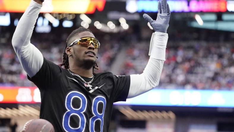 Feb 5, 2023; Paradise, Nevada, USA; NFC wide receiver CeeDee Lamb of the Dallas Cowboys (88) celebrates a touchdown against the AFC at the 2023 Pro Bowl at Allegiant Stadium. Mandatory Credit: Lucas Peltier-USA TODAY Sports