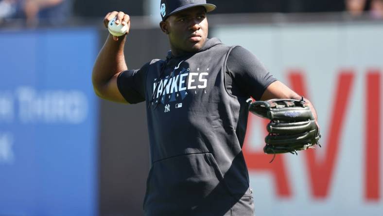 Feb 20, 2023; Tampa, FL, USA; New York Yankees center fielder Estevan Florial (90) works out during spring training practice at George M Steinbrenner Field. Mandatory Credit: Kim Klement-USA TODAY Sports