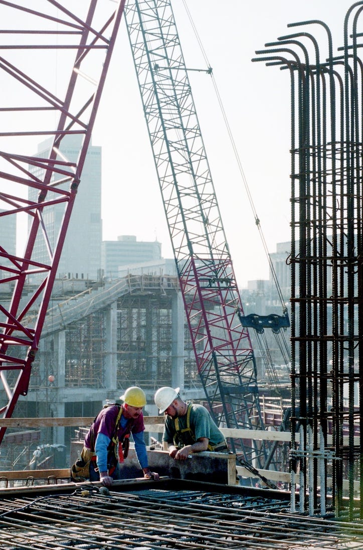 Bill Heggie and John Grace of Concrete Form Erectors stabilize a beam going up in the new football stadium on the East Bank in Nashville Feb. 24, 1998. Construction of the $165 million Oilers stadium is using almost 400 workers from the labor pool daily, causing other projects to struggle for manpower to complete them.