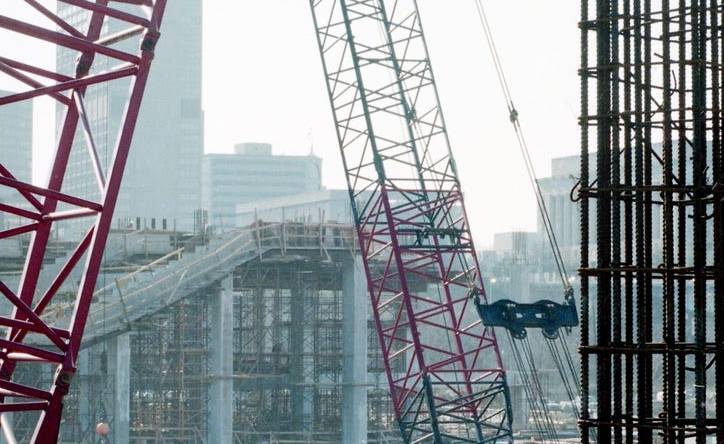 Bill Heggie and John Grace of Concrete Form Erectors stabilize a beam going up in the new football stadium on the East Bank in Nashville Feb. 24, 1998. Construction of the $165 million Oilers stadium is using almost 400 workers from the labor pool daily, causing other projects to struggle for manpower to complete them.