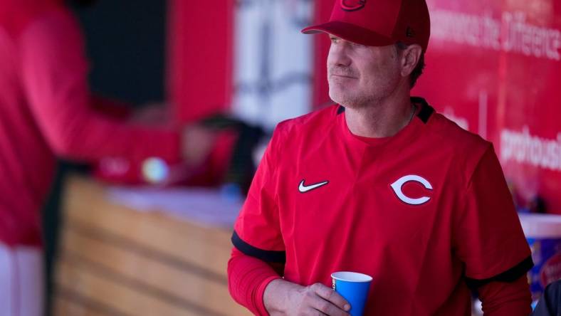 Cincinnati Reds manager David Bell stands by in the dugout during the eighth inning of the MLB Cactus League spring training game between the Cincinnati Reds and the Cleveland Guardians at Goodyear Ballpark in Goodyear, Ariz., on Saturday, Feb. 25, 2023.

Cleveland Guardians At Cincinnati Reds Spring Training