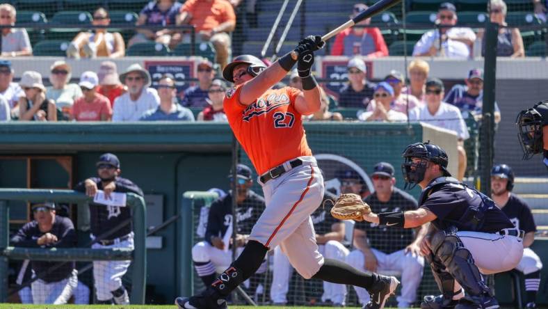 Feb 26, 2023; Lakeland, Florida, USA; Baltimore Orioles catcher James McCann (27) bats against the Detroit Tigers at Publix Field at Joker Marchant Stadium. Mandatory Credit: Mike Watters-USA TODAY Sports