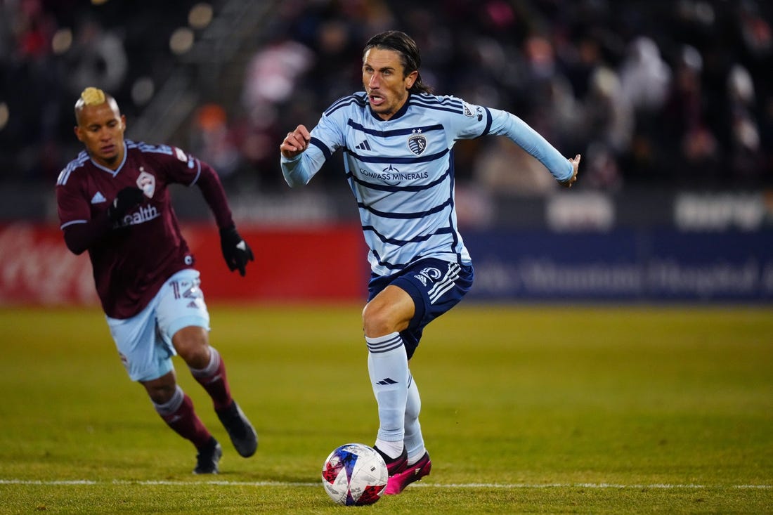 Mar 4, 2023; Commerce City, Colorado, USA; Sporting Kansas City defender Ben Sweat (2) breaks away with the ball during the second half against the Colorado Rapids at Dick's Sporting Goods Park. Mandatory Credit: Ron Chenoy-USA TODAY Sports