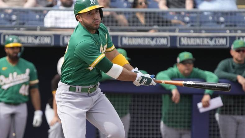 Mar 5, 2023; Peoria, Arizona, USA; Oakland Athletics right fielder Ramon Laureano (22) hits against the San Diego Padres in the first inning at Peoria Sports Complex. Mandatory Credit: Rick Scuteri-USA TODAY Sports