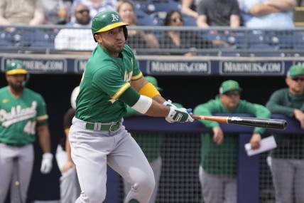 Mar 5, 2023; Peoria, Arizona, USA; Oakland Athletics right fielder Ramon Laureano (22) hits against the San Diego Padres in the first inning at Peoria Sports Complex. Mandatory Credit: Rick Scuteri-USA TODAY Sports