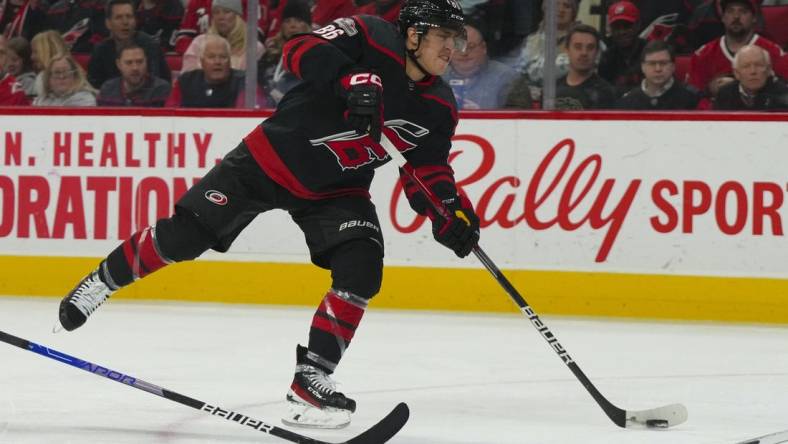 Mar 5, 2023; Raleigh, North Carolina, USA;  Carolina Hurricanes left wing Teuvo Teravainen (86) takes a shot against the Tampa Bay Lightning during the third period at PNC Arena. Mandatory Credit: James Guillory-USA TODAY Sports