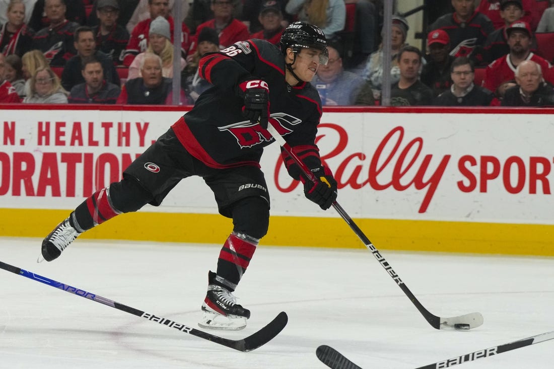 Mar 5, 2023; Raleigh, North Carolina, USA;  Carolina Hurricanes left wing Teuvo Teravainen (86) takes a shot against the Tampa Bay Lightning during the third period at PNC Arena. Mandatory Credit: James Guillory-USA TODAY Sports