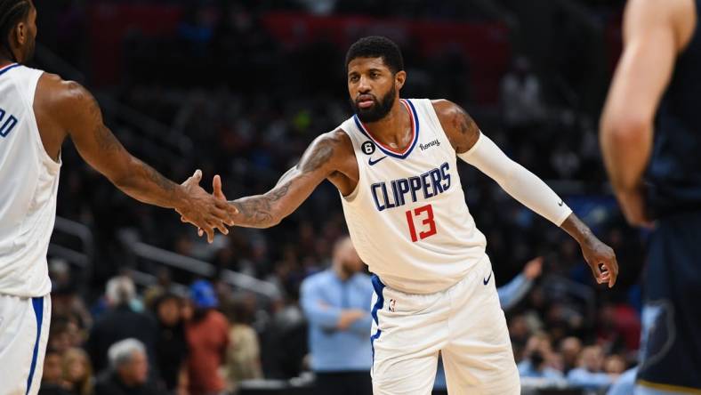 Mar 5, 2023; Los Angeles, California, USA; LA Clippers forward Paul George (13) celebrates with forward Kawhi Leonard (2) against [WHO] during fourth quarter at Crypto.com Arena. Mandatory Credit: Jonathan Hui-USA TODAY Sports