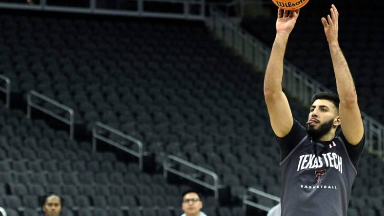 Texas Tech's forward Fardaws Aimaq (11) shoots the ball during practice ahead of the Big 12 basketball tournament, Tuesday, March 7, 2023, at T-Mobile Center in Kansas City.