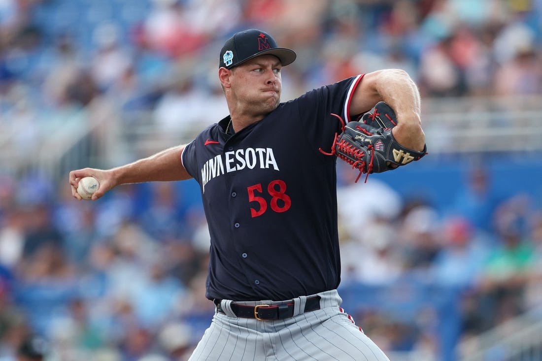 Mar 8, 2023; Dunedin, Florida, USA;  Minnesota Twins relief pitcher Trevor Megill (58) throws a pitch against the Toronto Blue Jays in the fifth inning during spring training at TD Ballpark. Mandatory Credit: Nathan Ray Seebeck-USA TODAY Sports