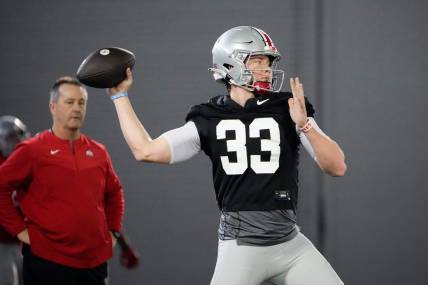 Mar 9, 2023; Columbus, Ohio, USA;  Ohio State Buckeyes quarterback Devin Brown (33) throws during spring football practice at the Woody Hayes Athletic Center. Mandatory Credit: Adam Cairns-The Columbus Dispatch

Football Buckeyes Spring Football