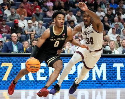 Vanderbilt guard Tyrin Lawrence (0) drives past Texas A&M forward Julius Marble (34) during the first half of a semifinal SEC Men   s Basketball Tournament game at Bridgestone Arena Saturday, March 11, 2023, in Nashville, Tenn.

Sec Basketball Vanderbilt Vs Texas A M