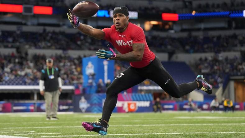 Mar 4, 2023; Indianapolis, IN, USA; Liberty wide receiver Demario Douglas (WO13) catches the ball during the NFL Scouting Combine at Lucas Oil Stadium. Mandatory Credit: Kirby Lee-USA TODAY Sports