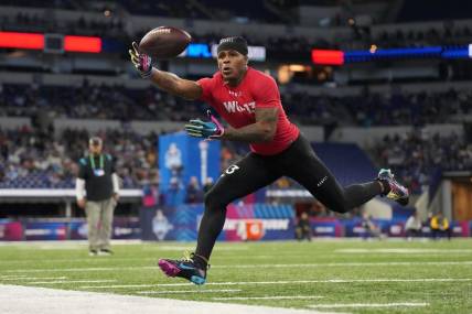 Mar 4, 2023; Indianapolis, IN, USA; Liberty wide receiver Demario Douglas (WO13) catches the ball during the NFL Scouting Combine at Lucas Oil Stadium. Mandatory Credit: Kirby Lee-USA TODAY Sports