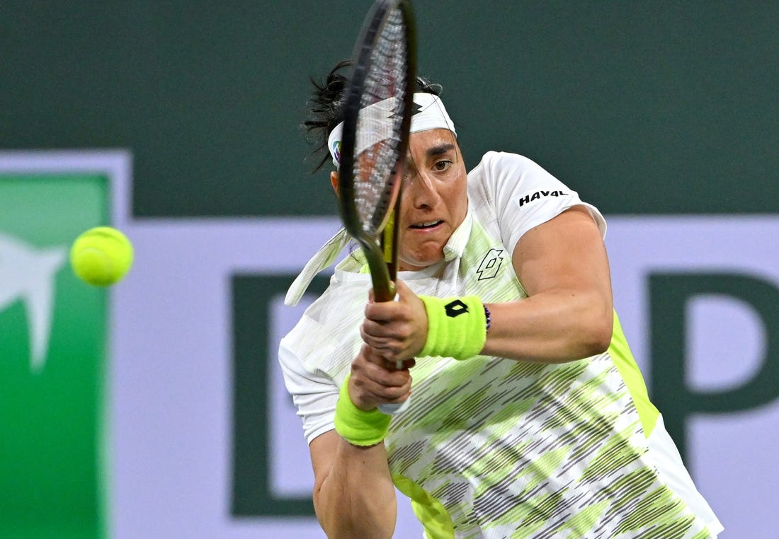 Mar 11, 2023; Indian Wells, CA, USA;  Ons Jabeur (TUN) hits a shot during her second round match against Magdalena Frech (POL) in the BNP Paribas Open at the Indian Wells Tennis Garden. Mandatory Credit: Jayne Kamin-Oncea-USA TODAY Sports