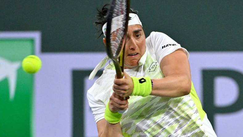 Mar 11, 2023; Indian Wells, CA, USA;  Ons Jabeur (TUN) hits a shot during her second round match against Magdalena Frech (POL) in the BNP Paribas Open at the Indian Wells Tennis Garden. Mandatory Credit: Jayne Kamin-Oncea-USA TODAY Sports