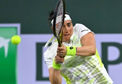 Mar 11, 2023; Indian Wells, CA, USA;  Ons Jabeur (TUN) hits a shot during her second round match against Magdalena Frech (POL) in the BNP Paribas Open at the Indian Wells Tennis Garden. Mandatory Credit: Jayne Kamin-Oncea-USA TODAY Sports