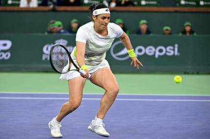 Mar 11, 2023; Indian Wells, CA, USA;  Ons Jabeur (TUN) hits a shot during her second round match against Magdalena Frech (POL) in the BNP Paribas Open at the Indian Wells Tennis Garden. Mandatory Credit: Jayne Kamin-Oncea-USA TODAY Sports