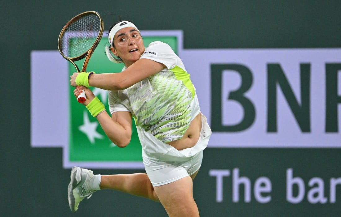 Mar 11, 2023; Indian Wells, CA, USA;  Ons Jabeur (TUN) hits a shot during her second round match against Magdalena Frech (POL) in the BNP Paribas Open at the Indian Wells Tennis Garden. Mandatory Credit: Jayne Kamin-Oncea-USA TODAY Sports