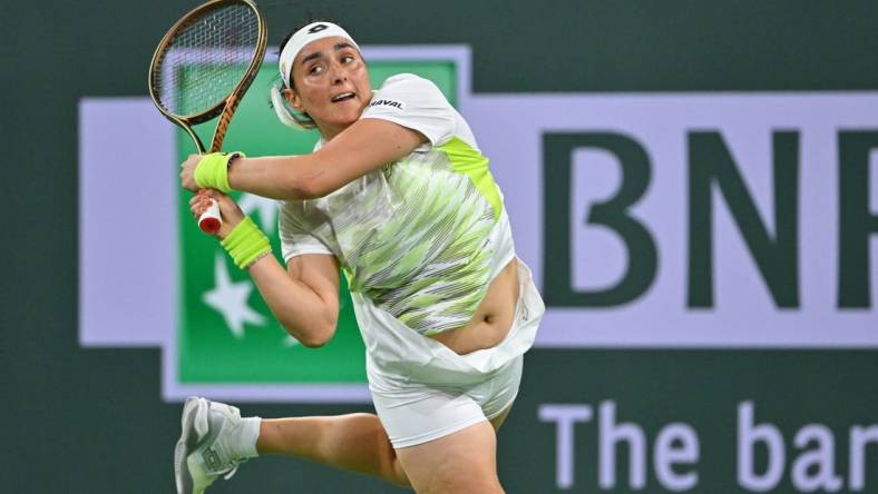 Mar 11, 2023; Indian Wells, CA, USA;  Ons Jabeur (TUN) hits a shot during her second round match against Magdalena Frech (POL) in the BNP Paribas Open at the Indian Wells Tennis Garden. Mandatory Credit: Jayne Kamin-Oncea-USA TODAY Sports