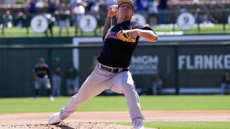 Mar 13, 2023; Phoenix, Arizona, USA; Cleveland Guardians starting pitcher Zach Plesac (34) pitches against the Los Angeles Dodgers during the first inning at Camelback Ranch-Glendale. Mandatory Credit: Joe Camporeale-USA TODAY Sports