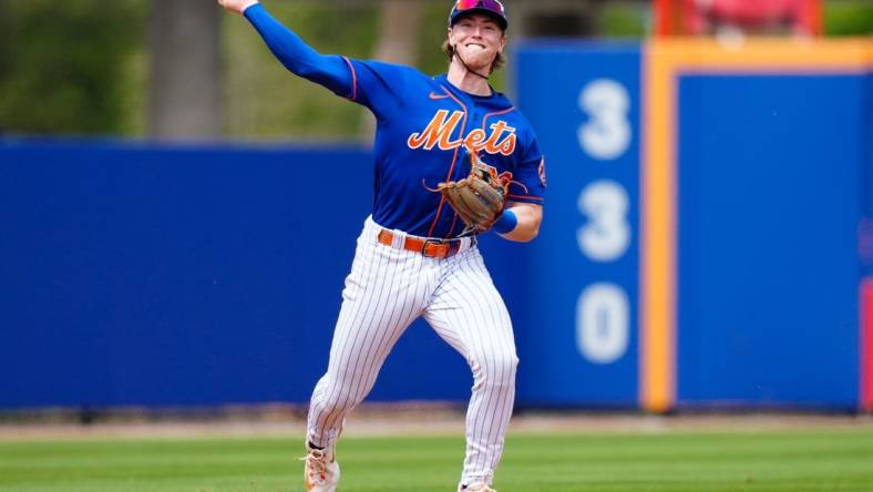 Mar 14, 2023; Port St. Lucie, Florida, USA; New York Mets third baseman Brett Baty (22) throws the ball to first against the Washington Nationals during the second inning at Clover Park. Mandatory Credit: Rich Storry-USA TODAY Sports