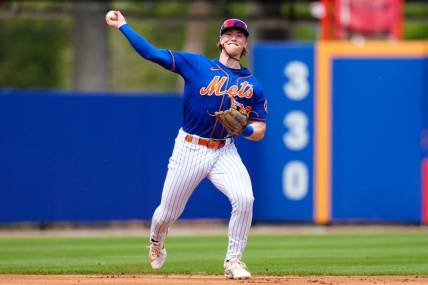 Mar 14, 2023; Port St. Lucie, Florida, USA; New York Mets third baseman Brett Baty (22) throws the ball to first against the Washington Nationals during the second inning at Clover Park. Mandatory Credit: Rich Storry-USA TODAY Sports