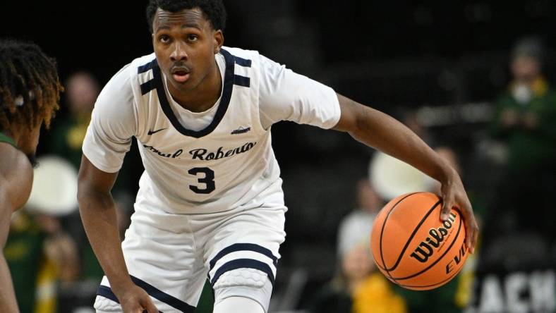 Mar 7, 2023; Sioux Falls, SD, USA;  Oral Roberts Golden Eagles guard Max Abmas (3) dribbles against the North Dakota State Bison in the second half at Denny Sanford Premier Center. Mandatory Credit: Steven Branscombe-USA TODAY Sports