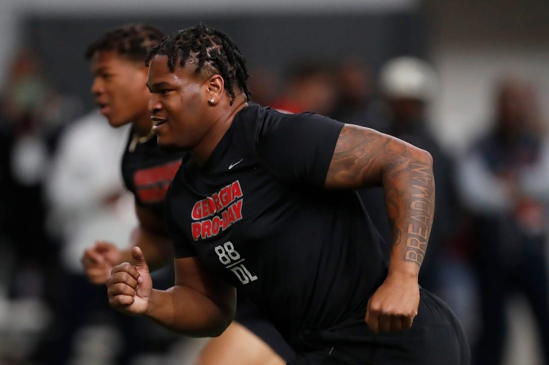 Georgia defensive lineman Jalen Carter (88) and Georgia linebacker Nolan Smith (4) run a drill during UGA Pro Day in Athens, Ga., on Wednesday, March 15, 2023.

News Joshua L Jones