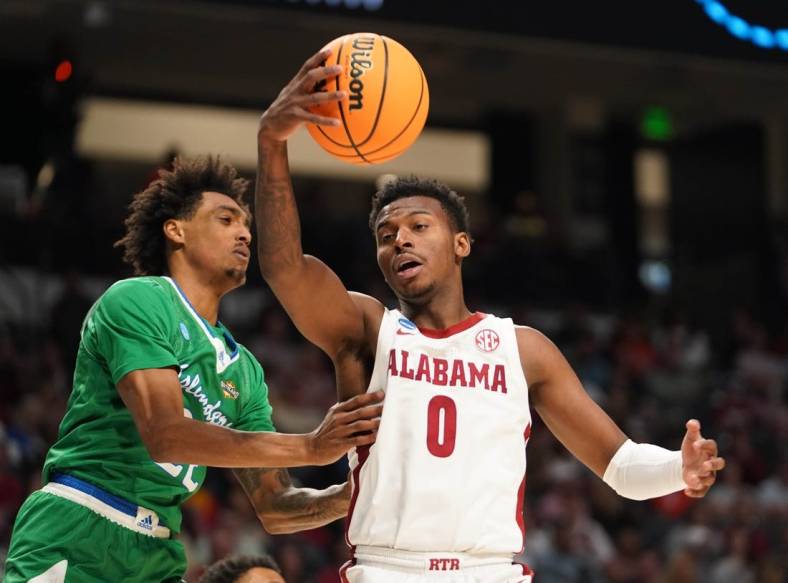 Mar 16, 2023; Birmingham, AL, USA;  Alabama Crimson Tide guard Jaden Bradley (0) passes the ball away from Texas A&M-CC Islanders guard Simeon Fryer (22) during the second half in the first round of the 2023 NCAA Tournament at Legacy Arena. Mandatory Credit: Marvin Gentry-USA TODAY Sports