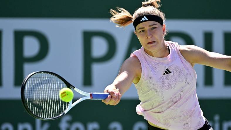 Mar 16, 2023; Indian Wells, CA, USA;  Karolina Muchova (CZE) hits a shot against Elena Rybakina (KAZ) in her quarterfinal match in the BNP Paribas Open at the Indian Wells Tennis Garden. Mandatory Credit: Jayne Kamin-Oncea-USA TODAY Sports