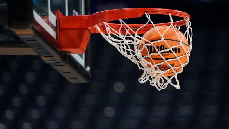 Mar 16, 2023; Columbus, Ohio, USA;  A ball falls through the net during a practice for the NCAA men   s basketball tournament at Nationwide Arena. Mandatory Credit: Adam Cairns-The Columbus Dispatch

Basketball Ncaa Men S Basketball Tournament