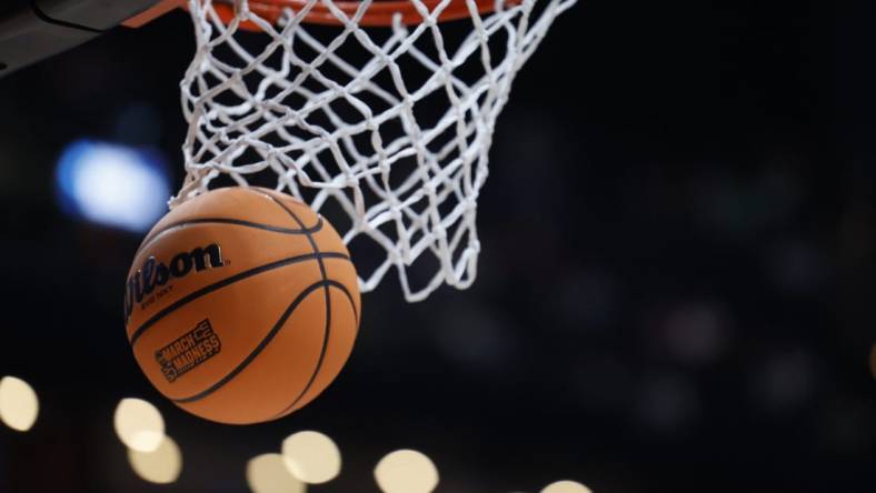 Mar 17, 2023; Columbus, OH, USA;  A basketball displaying the March Madness logo enter the basket before the game between the USC Trojans and the Michigan State Spartans at Nationwide Arena. Mandatory Credit: Rick Osentoski-USA TODAY Sports