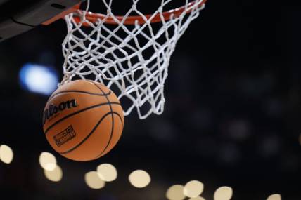 Mar 17, 2023; Columbus, OH, USA;  A basketball displaying the March Madness logo enter the basket before the game between the USC Trojans and the Michigan State Spartans at Nationwide Arena. Mandatory Credit: Rick Osentoski-USA TODAY Sports
