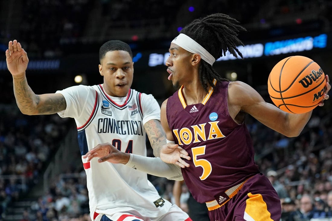 Mar 17, 2023; Albany, NY, USA; Iona Gaels guard Daniss Jenkins (5) dribbles the ball against UConn Huskies guard Jordan Hawkins (24) during the first half at MVP Arena. Mandatory Credit: David Butler II-USA TODAY Sports