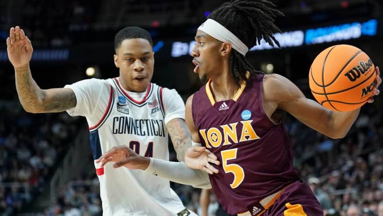 Mar 17, 2023; Albany, NY, USA; Iona Gaels guard Daniss Jenkins (5) dribbles the ball against UConn Huskies guard Jordan Hawkins (24) during the first half at MVP Arena. Mandatory Credit: David Butler II-USA TODAY Sports