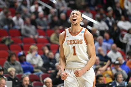 Mar 18, 2023; Des Moines, IA, USA; Texas Longhorns forward Dylan Disu (1) celebrates in the last seconds of a victory over the Penn State Nittany Lions at Wells Fargo Arena. Mandatory Credit: Jeffrey Becker-USA TODAY Sports