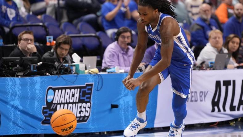 Mar 19, 2023; Greensboro, NC, USA;  Kentucky Wildcats guard Antonio Reeves (12) goes for a loose ball during the second half against the Kansas State Wildcats in the second round of the 2023 NCAA men   s basketball tournament at Greensboro Coliseum. Mandatory Credit: Bob Donnan-USA TODAY Sports