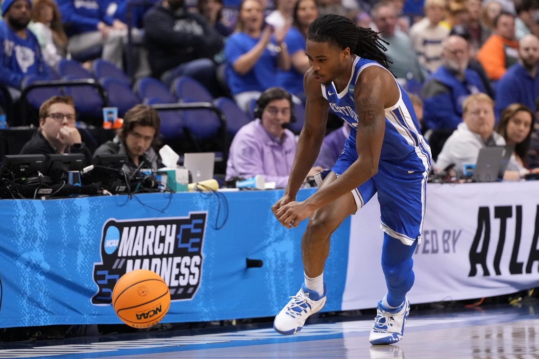 Mar 19, 2023; Greensboro, NC, USA;  Kentucky Wildcats guard Antonio Reeves (12) goes for a loose ball during the second half against the Kansas State Wildcats in the second round of the 2023 NCAA men   s basketball tournament at Greensboro Coliseum. Mandatory Credit: Bob Donnan-USA TODAY Sports