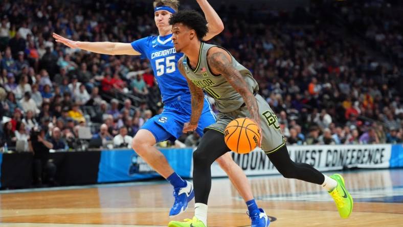 Mar 19, 2023; Denver, CO, USA; Baylor Bears forward Jalen Bridges (11) drives against Creighton Bluejays guard Baylor Scheierman (55) in the first half at Ball Arena. Mandatory Credit: Ron Chenoy-USA TODAY Sports