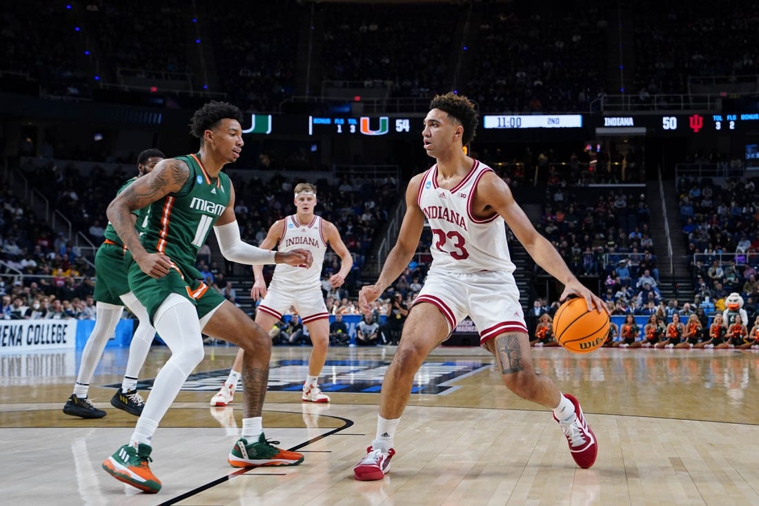 Mar 19, 2023; Albany, NY, USA; Indiana Hoosiers forward Trayce Jackson-Davis (23) dribbles the ball against Miami (Fl) Hurricanes guard Jordan Miller (11) during the second half at MVP Arena. Mandatory Credit: Gregory Fisher-USA TODAY Sports