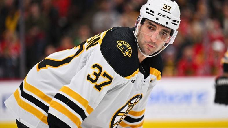 Mar 14, 2023; Chicago, Illinois, USA;  Boston Bruins forward Patrice Bergeron (37) skates against the Chicago Blackhawks at United Center. Mandatory Credit: Jamie Sabau-USA TODAY Sports