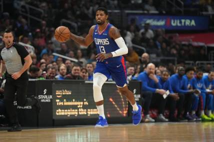 Mar 21, 2023; Los Angeles, California, USA; LA Clippers forward Paul George (13) dribbles the ball against the Oklahoma City Thunder in the first half at Crypto.com Arena. Mandatory Credit: Kirby Lee-USA TODAY Sports