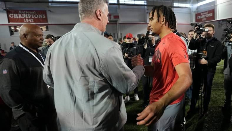 Ohio State Buckeyes quarterback C.J. Stroud talks to Carolina Panthers head coach Frank Reich during Ohio State football's pro day at the Woody Hayes Athletic Center in Columbus on March 22, 2023.

Football Ceb Osufb Pro Day