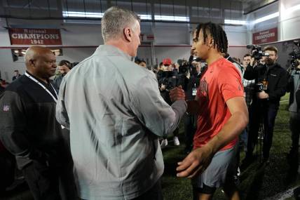Ohio State Buckeyes quarterback C.J. Stroud talks to Carolina Panthers head coach Frank Reich during Ohio State football's pro day at the Woody Hayes Athletic Center in Columbus on March 22, 2023.

Football Ceb Osufb Pro Day