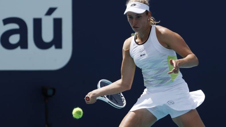 Mar 23, 2023; Miami, Florida, US; Elise Mertens (BEL) hits a forehand against Daria Kasatkina (not pictured) on day four of the Miami Open at Hard Rock Stadium. Mandatory Credit: Geoff Burke-USA TODAY Sports